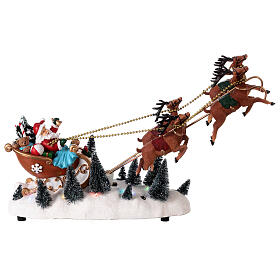 Slitta Babbo Natale neve renne volanti luci led 35x45x15 cm