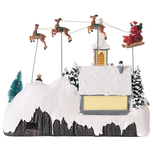 Snowy Christmas village, church with Santa in motion, LED lights, 30x35x18 cm 5