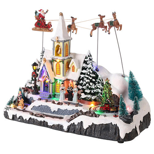 Pueblo Navidad nieve iglesia trineo papá noel movimiento luces led 30x35x18 3