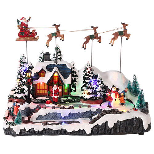 Snowy Christmas village with Santa sleigh animated LED lights 30x35x18 cm 1