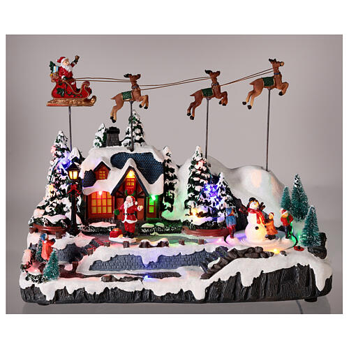 Snowy Christmas village with Santa sleigh animated LED lights 30x35x18 cm 2