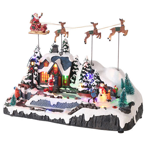 Snowy Christmas village with Santa sleigh animated LED lights 30x35x18 cm 3