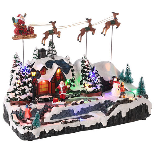 Snowy Christmas village with Santa sleigh animated LED lights 30x35x18 cm 4