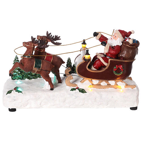 Santa's sleigh with snow and reindeers in motion, LED lights, 15x25x10 cm 1