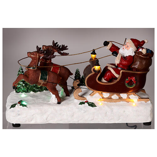 Santa's sleigh with snow and reindeers in motion, LED lights, 15x25x10 cm 2