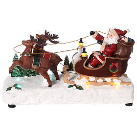 Trineo Papá Noel nieve renos movimiento luces led 15x25x10 cm