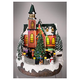 Christmas village with snow, church and animated Christmas tree, LED lights, 35x25x30 cm