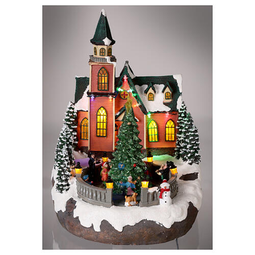 Christmas village with snow, church and animated Christmas tree, LED lights, 35x25x30 cm 2