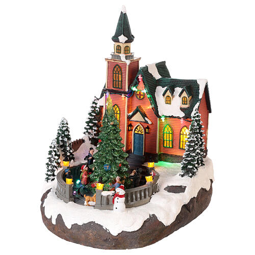 Christmas village with snow, church and animated Christmas tree, LED lights, 35x25x30 cm 3