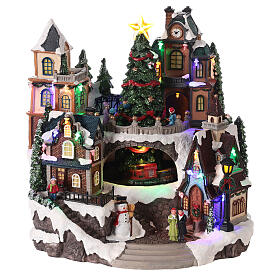 Christmas village with train in motion in a tunnel 30x30x25 cm