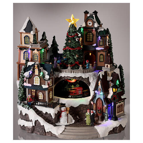 Christmas village with train in motion in a tunnel 30x30x25 cm 2