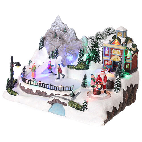Christmas village with moving characters and LED lights 20x30x20 cm 3