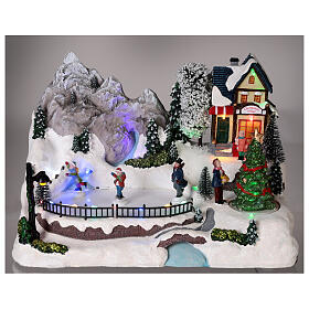 Christmas set with snow, ice skaters on motion, LED lights, 20x30x20 cm