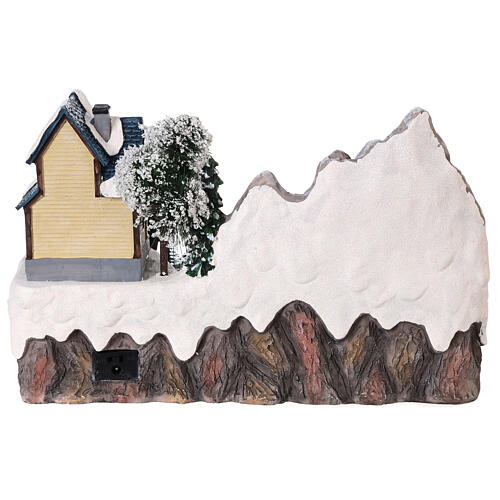 Scena natalizia neve pattinatori movimento luci led 20x30x20 cm 5