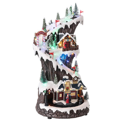 Christmas village, snowy mountain with train in motion, LED lights ...