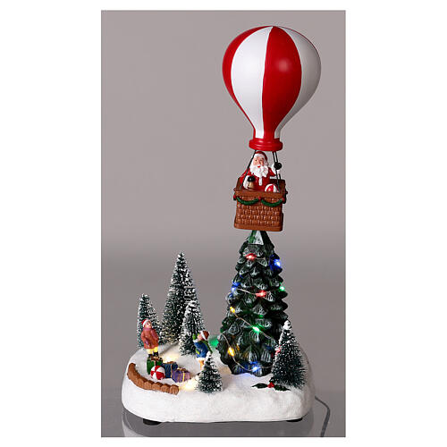 Christmas village with snow and an airship in motion, LED lights, 30x15x10 cm 2