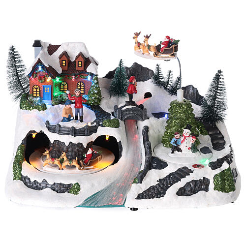 Scena natalizia neve slitta babbo Natale movimento luci led 20x30x15 cm  1
