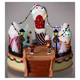 Giostra gelato pattinatori movimento luci led 20x25x25 cm