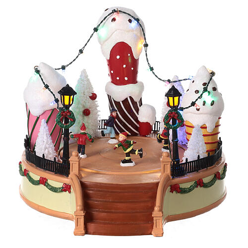 Giostra gelato pattinatori movimento luci led 20x25x25 cm 1