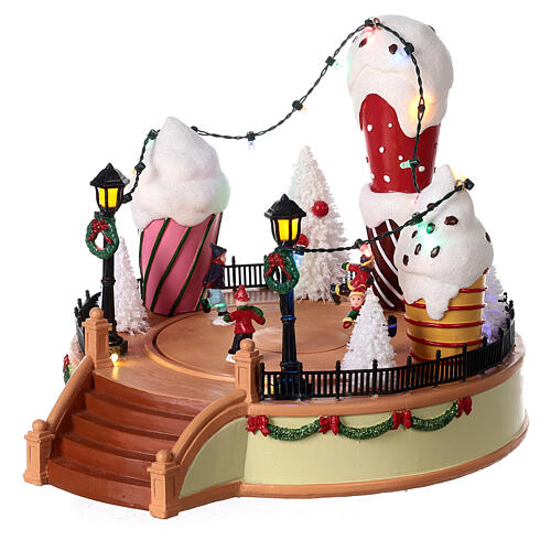 Giostra gelato pattinatori movimento luci led 20x25x25 cm 3