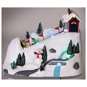 Christmas snowy village, mountain with skiers in motion, LED lights, 20x30x15 cm