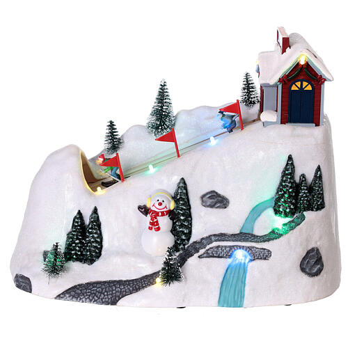Christmas snowy village, mountain with skiers in motion, LED lights, 20x30x15 cm 1