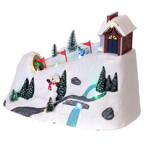 Christmas snowy village, mountain with skiers in motion, LED lights, 20x30x15 cm 4