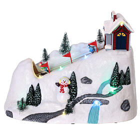Villaggio natale neve montagna sciatori movimento luci led 20x30x15 cm