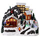 Christmas village with snow and skaters in motion, LED lights, 20x30x20 cm s1
