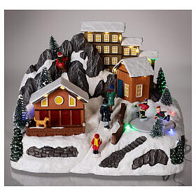 Villaggio Natale neve pattinatori movimento luci led 20x30x20 cm