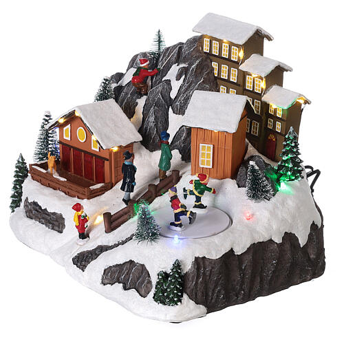 Villaggio Natale neve pattinatori movimento luci led 20x30x20 cm 3