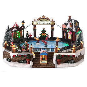 Christmas set with ice rink and skaters in motion, LED lights, 20x30x25 cm