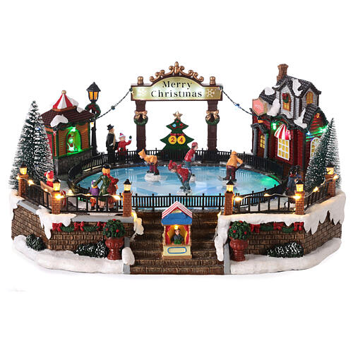 Christmas set with ice rink and skaters in motion, LED lights, 20x30x25 cm 1