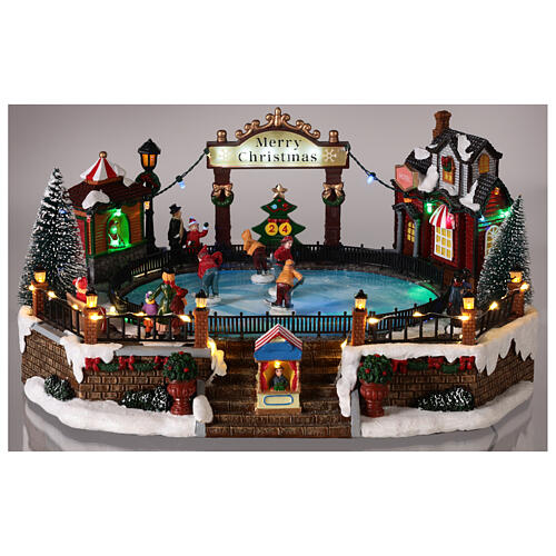 Christmas set with ice rink and skaters in motion, LED lights, 20x30x25 cm 2