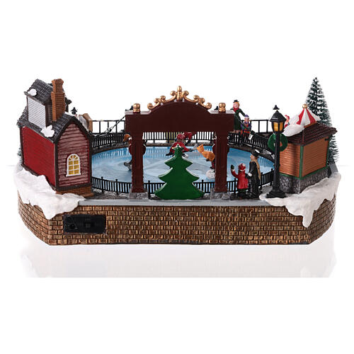 Christmas set with ice rink and skaters in motion, LED lights, 20x30x25 cm 5