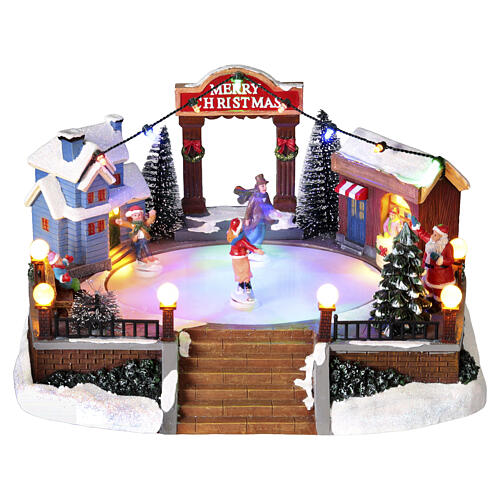 Christmas set with ice rink and skaters in motion, LED lights, 20x20x15 cm 1