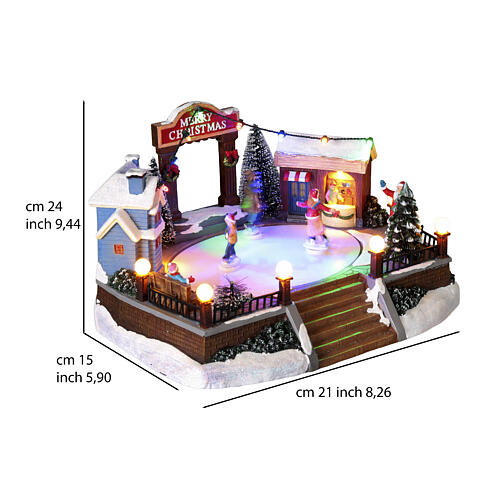 Escena navideña pista patinaje movimiento luces led 20x20x15 cm 3