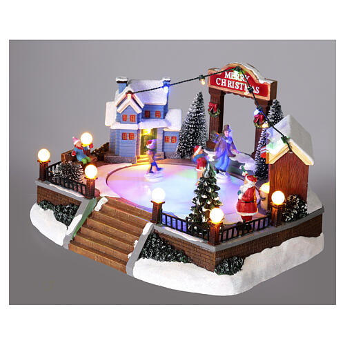 Scenografia natalizia pista pattinaggio movimento luci led 20x20x15 cm 4