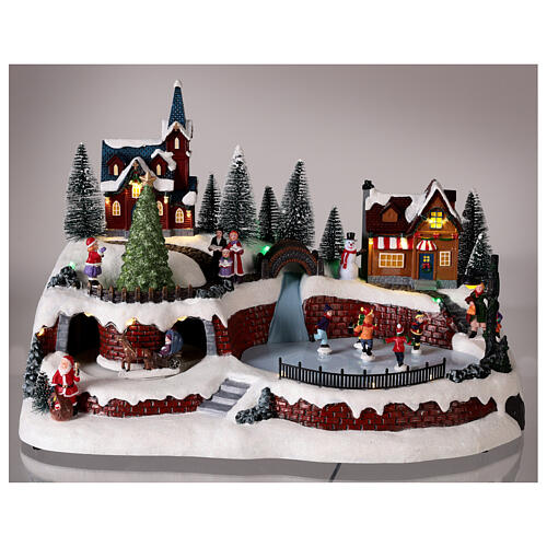 Christmas village set with snow and skaters in motion, LED lights, 25x40x25 cm 2