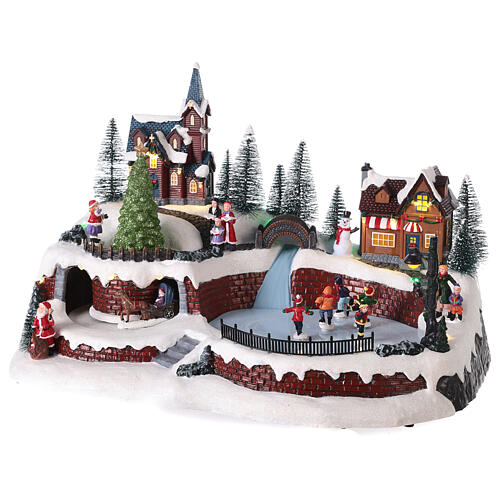 Christmas village set with snow and skaters in motion, LED lights, 25x40x25 cm 3