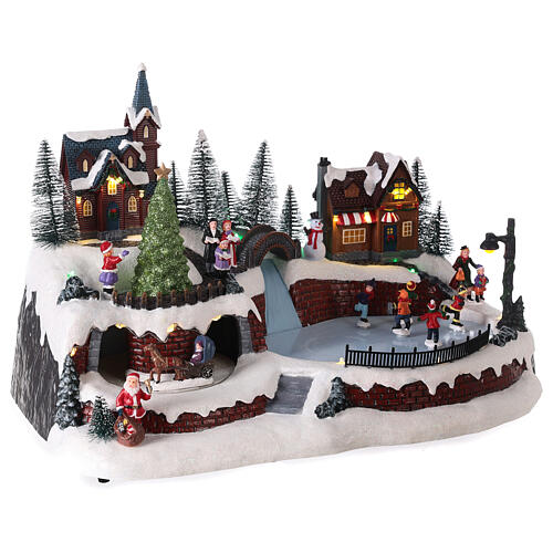 Christmas village set with snow and skaters in motion, LED lights, 25x40x25 cm 4