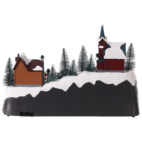 Christmas village set with snow and skaters in motion, LED lights, 25x40x25 cm 5