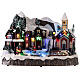 Snowy Christmas village with skiers and skaters in motion, LED lights, 25x30x20 cm s1