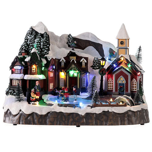 Villaggio Natale neve sciatori pattinatori movimento luci led 25x30x20 cm 1