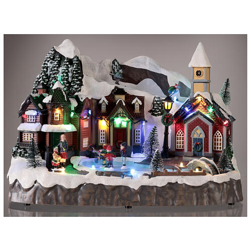 Villaggio Natale neve sciatori pattinatori movimento luci led 25x30x20 cm 2