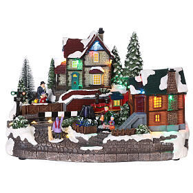 Christmas setting with snow and train in motion, LED lights, 20x30x20 cm