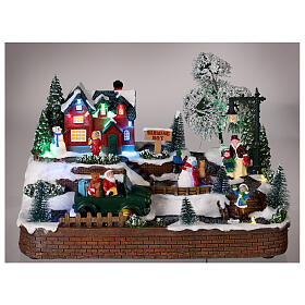 Villaggio natalizio neve macchina pupazzo movimento luci led 15x30x15 cm