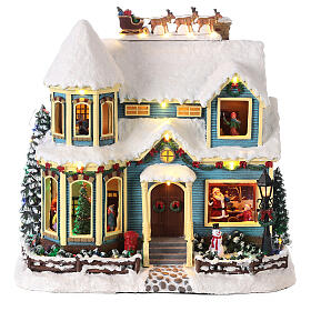 Scena natalizia neve casa slitta babbo Natale luci led 35x35x20 cm