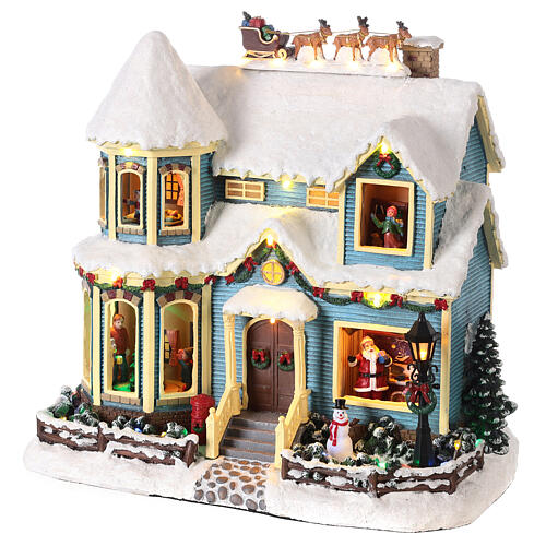 Snowy Christmas scene house sled Santa Claus LED lights 35x35x20 cm 3