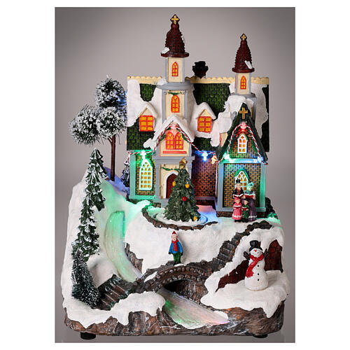 Christmas village with snow, church and Christmas tree, LED lights, 30x20x20 cm 2